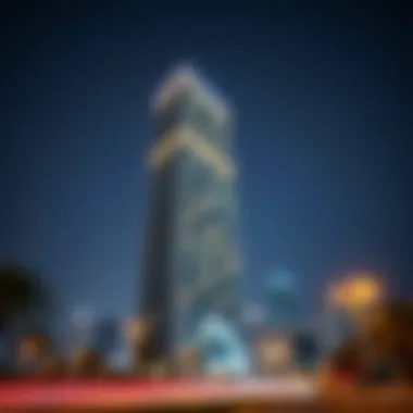 Safa Tower 2 Illuminated at Night Render of Safa Tower 2 at night, illuminated against the backdrop of the city lights