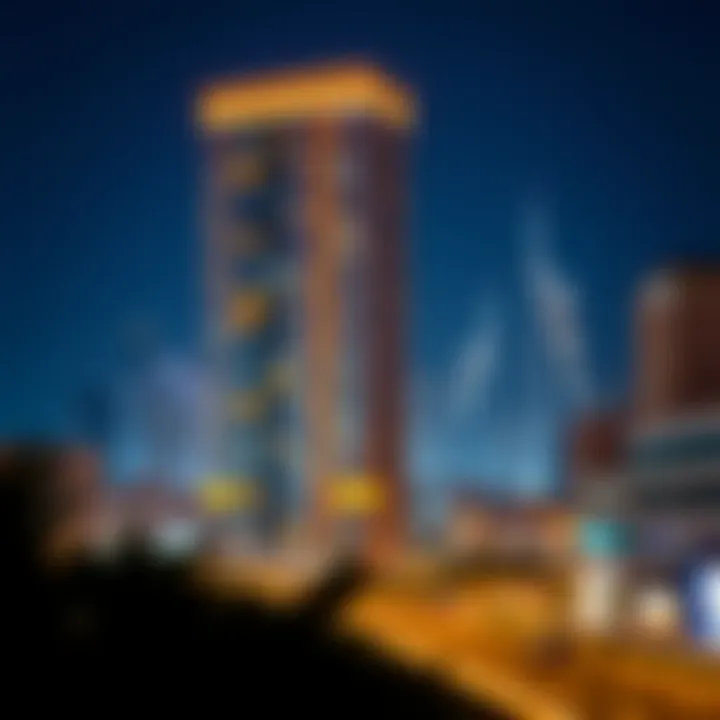 Night View of Al Nahda Tower Block B Night view of Al Nahda Tower Block B illuminated against the Dubai skyline